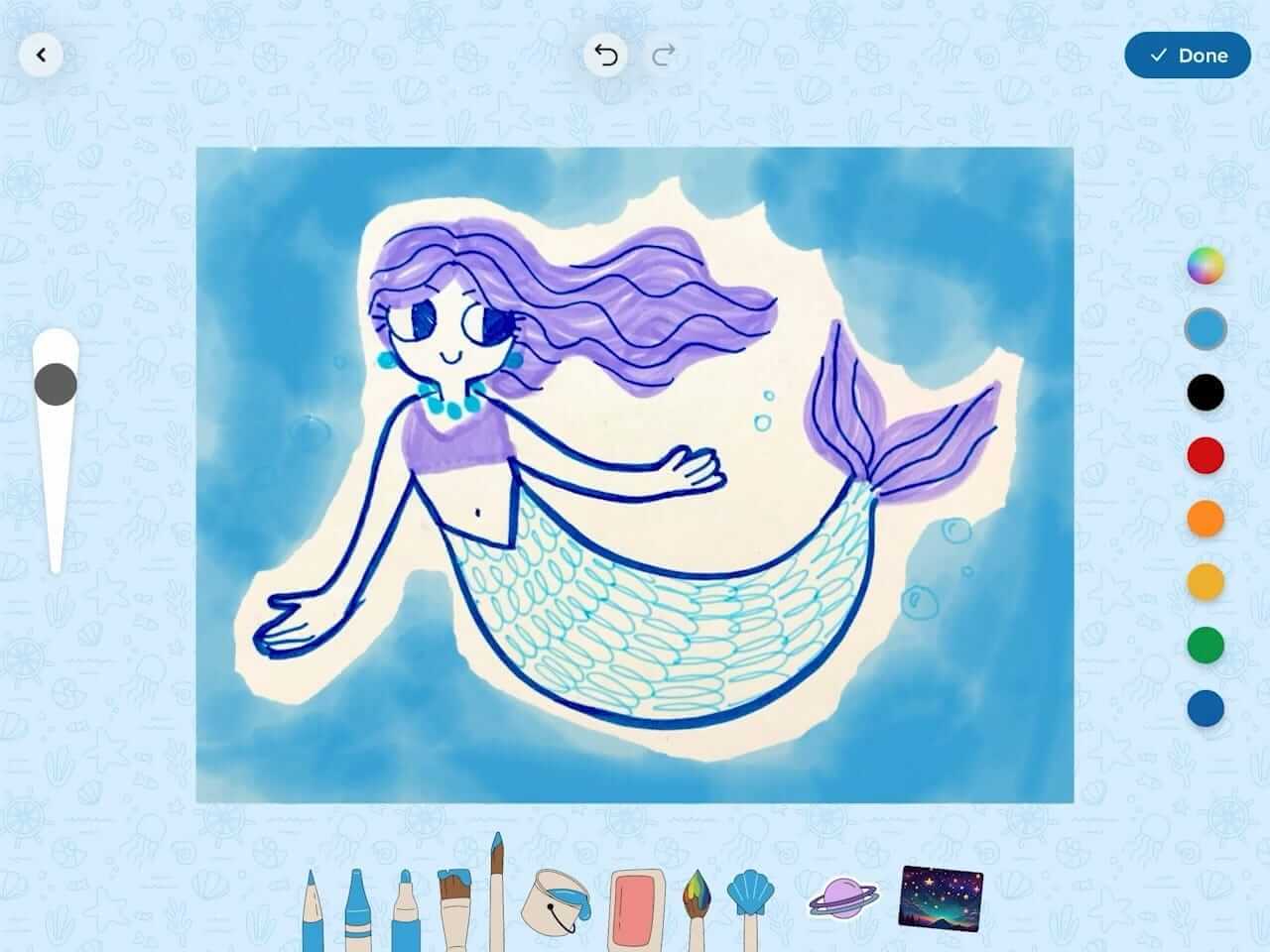 A child’s drawing of a mermaid appears on a blue background surrounded by in-app coloring tools.